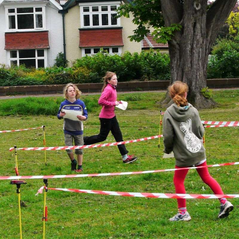 School children finding their way round maze