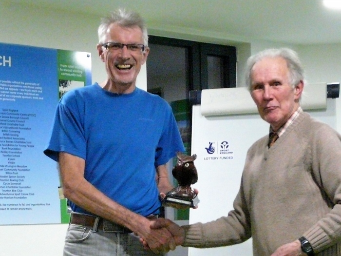 Gavin receives the QOAD owl trophy from Mike Crockett