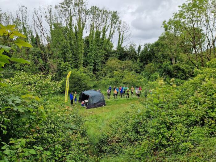 Runners waiting for their team mates to finish